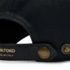 Cappellino in tela e pelle liscia
