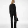 Pantaloni larghi in seta con pieghe Pantaloni larghi in seta con pieghe