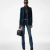 Pantaloni svasati in denim grezzo elasticizzato Pantaloni svasati in denim grezzo elasticizzato