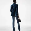 Pantaloni svasati in denim grezzo elasticizzato Pantaloni svasati in denim grezzo elasticizzato