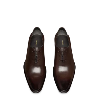 Scarpe stringate in pelle brunita