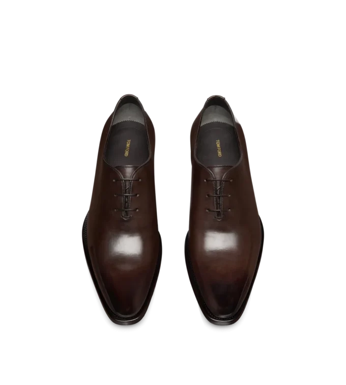 Scarpe stringate in pelle brunita