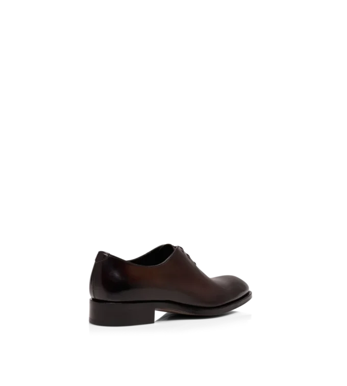 Scarpe stringate in pelle brunita