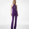 Tuta in seta con scollo all’americana e drappeggio sul davanti Tuta in seta con scollo all’americana e drappeggio sul davanti